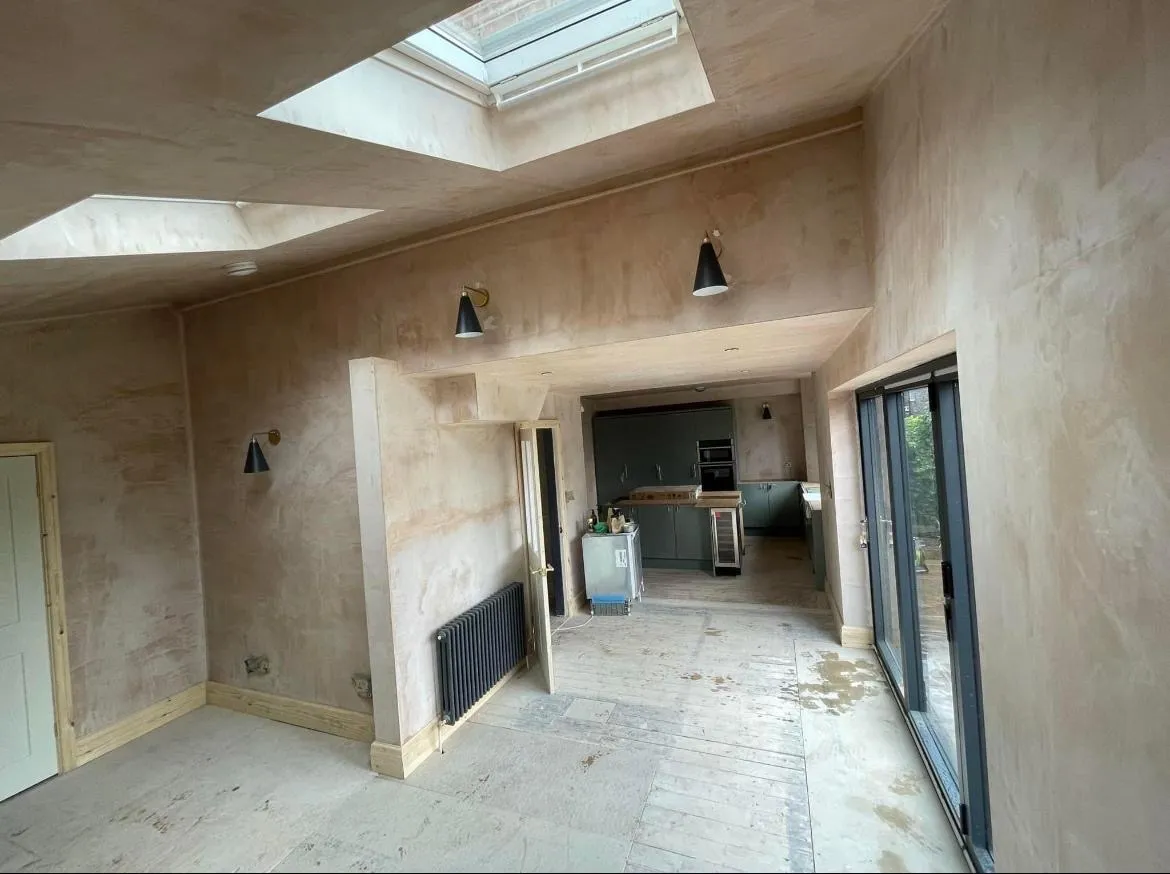 A room that has a skylight and some windows.